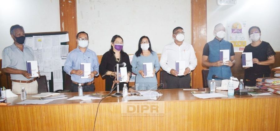 Advisor IT, S&T and N&RE, Mmhonlumo Kikon releasing the ‘Anglo-Lotha Dictionary’ at the Wokha District Planning and Development Board meeting held on September 15. (DIPR Photo)